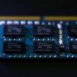A close-up shot of an sk hynix chipmaking product, specifically a blue circuit board featuring multiple black memory chips with the sk hynix logo